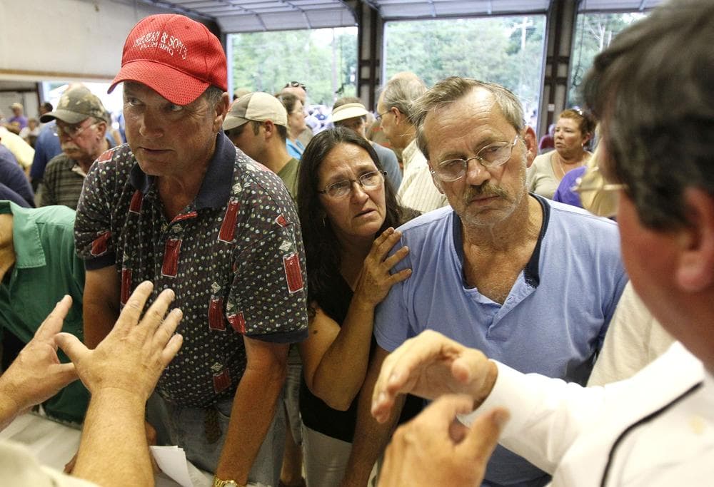 Residents react as they listen to officials with the Army Corps of Engineers discuss forecasted floodwater depths at a town hall meeting in Butte LaRose, La. (AP)