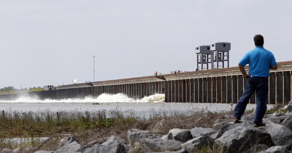 A man watches water diverted from the Mississippi River spills through a bay in the Morganza Spillway in Morganza, La., Saturday, May 14, 2011. (AP)