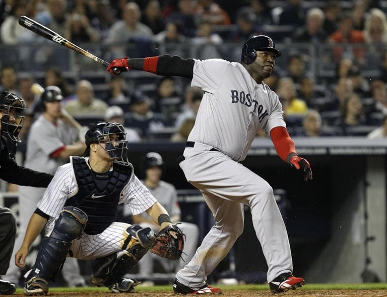 Boston Red Sox designated hitter David Ortiz hits a solo home run off New York Yankees starting pitcher Freddy Garcia,  Sunday. (AP)