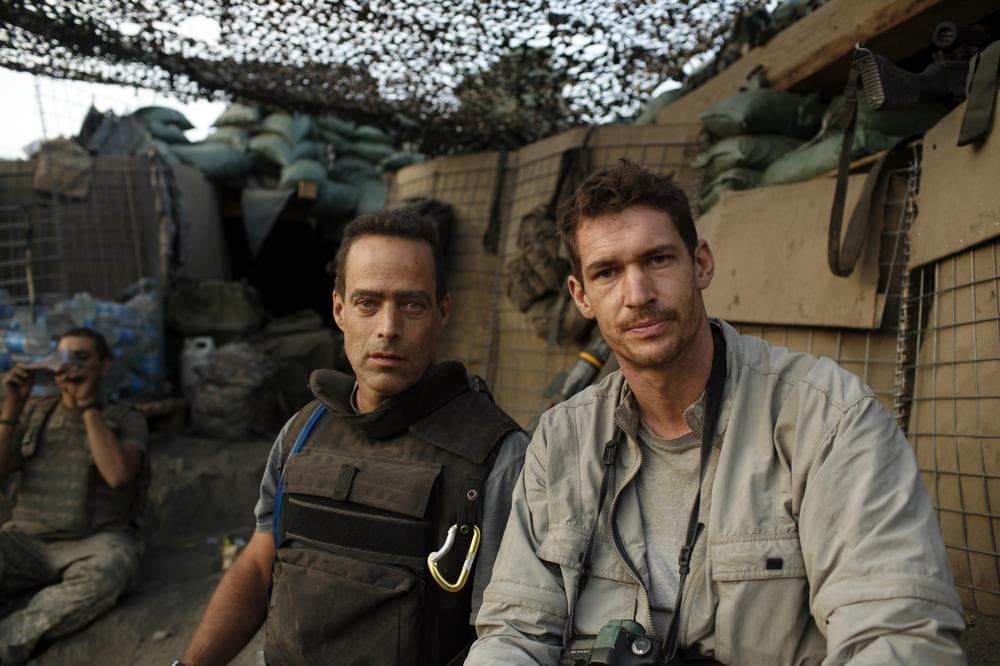 Directors and journalists Sebastian Junger, left, and Tim Hetherington are shown at the Restrepo outpost in the Korengal Valley, Afghanistan, during the filming of their documentary  &quot;Restrepo&quot;. Hetherington was recently killed while reporting from Libya. (AP/Outpost Films/Tim Hetherington)