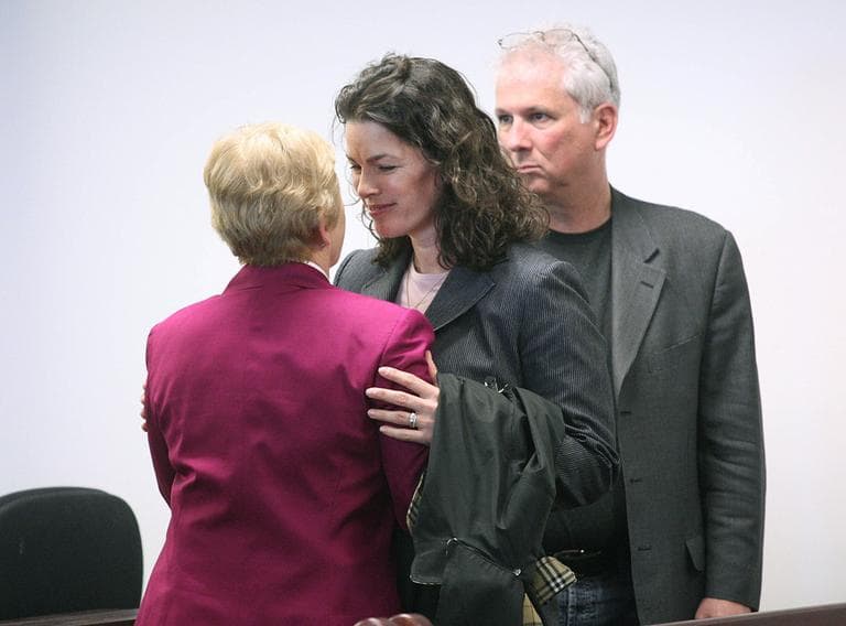 Former Olympic figure skater Nancy Kerrigan, center, embraces her mother Brenda Kerrigan, left, as her husband Jerry Solomon, right, looks on after the first day of testimony in the manslaughter trial of Nancy's brother Mark Kerrigan at Middlesex Superior Court, in Woburn, Mass., Monday. (AP)