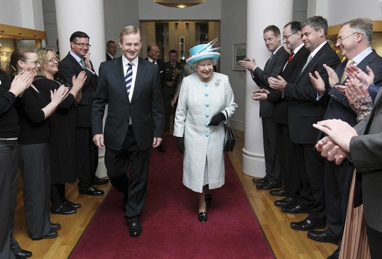 Britain&#039;s Queen Elizabeth II and Irish Prime Minister Enda Kenny walk together in Dublin, Ireland, Wednesday. (AP)