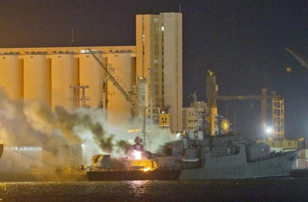 Smoke and flames pour from the Libyan Navy frigate Al Ghardabia, after it was hit during an airstrike by Tornado bombers of Britain's Royal Force on the port area of Tripoli, in the early hours of Friday May 20, 2011. (AP)