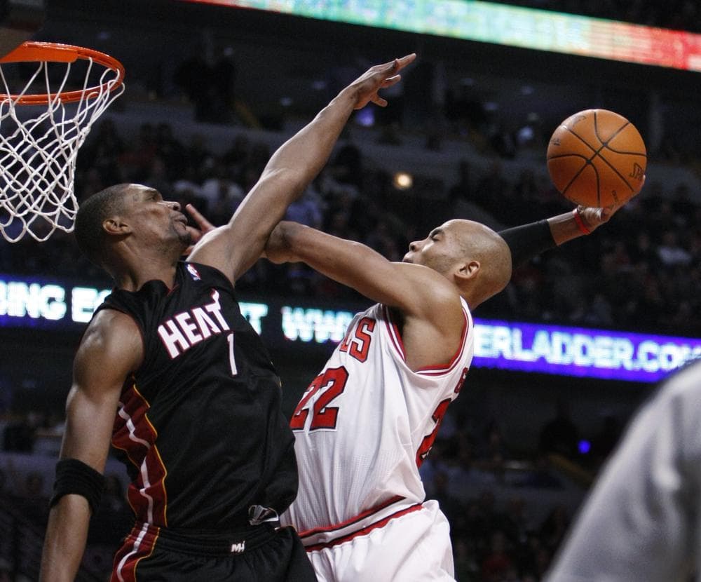 Chicago Bulls forward Taj Gibson and Miami Heat forward Chris Bosh battled for every basket during Game 1 of the NBA Eastern Conference Finals. (AP)