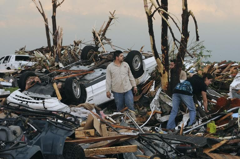 Residents dig through the rubble after a tornado hit Joplin, Mo., Sunday evening. (AP)
