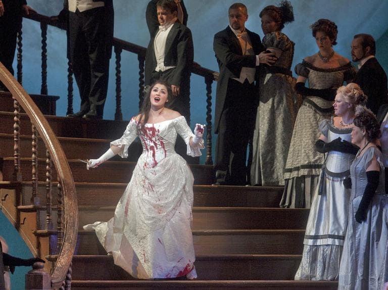 In this 2009 photo provided by New York's Metropolitan Opera, Anna Netrebko, foreground left, appears in the title role of Donizetti's &quot;Lucia di Lammermoor.&quot; (AP)