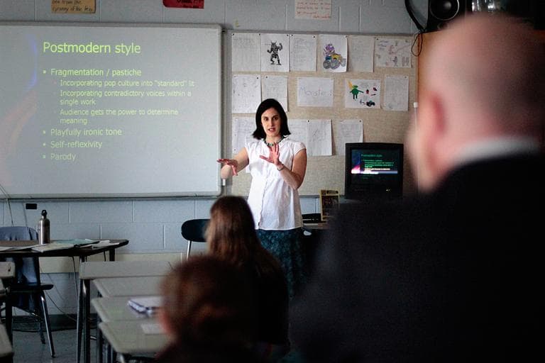 Alison Courchesne conducts her Framingham High class while Stand for Children's Jason Williams, right, evaluates her. (Jesse Costa/WBUR)