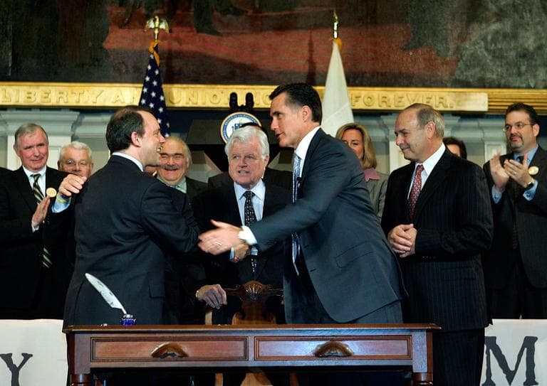 Romney signed the state's health reform law in 2006