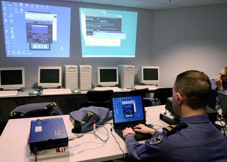 In this 2002 file photo, Norwich University senior Jason Glanowsky watches a computer attack on his fellow students at the Norwich University computer security training program in Northfield, Vt. (AP)