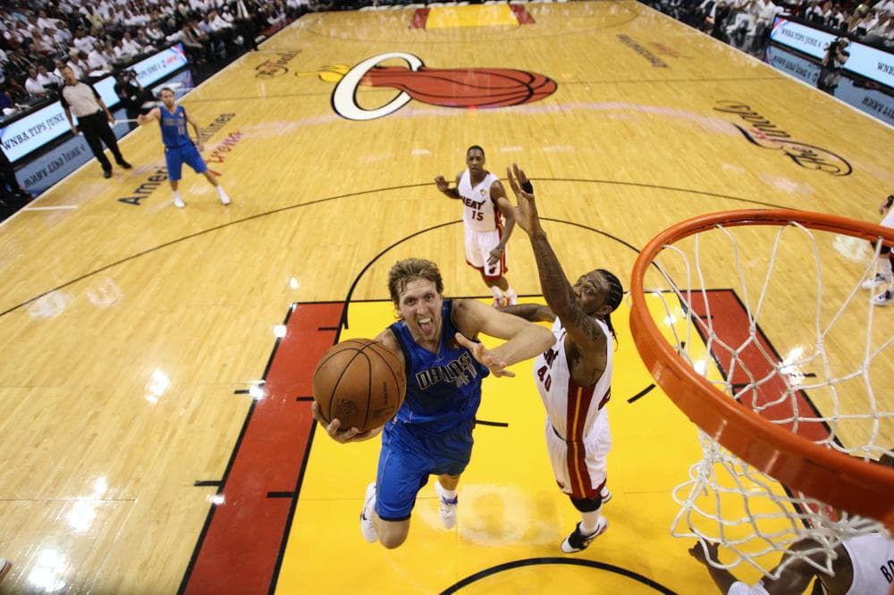The Heat's Udonis Haslem defends against Dallas Mavericks star Dirk Nowitzki during Game 1 of the NBA Finals Tuesday in Miami. (AP)