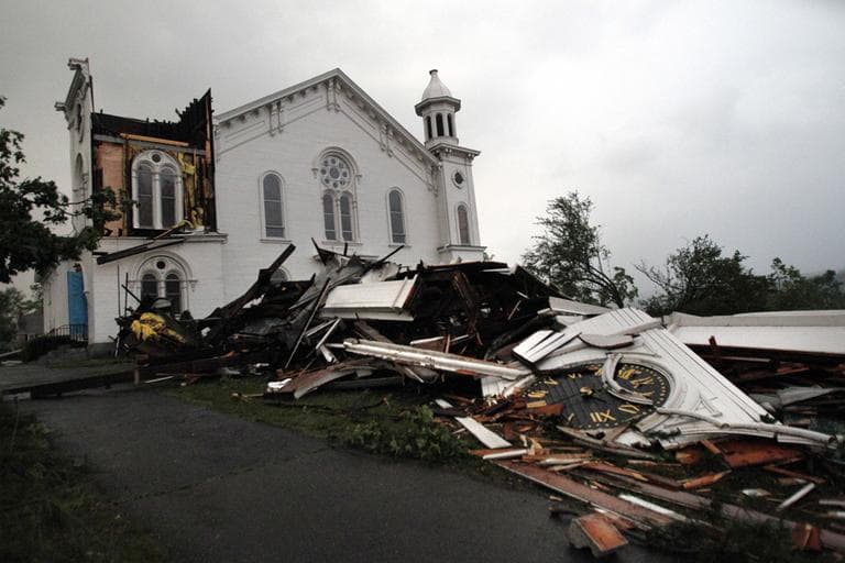 The steeple of The First Church of Monson lay in rubble on the ground after a tornado swept through the downtown area of Monson, Mass., Wednesday. (AP)