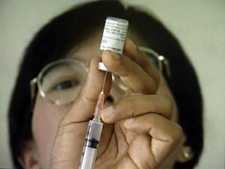A researcher during a test of an experimental HIV/Aids vaccine. According to Brown's Dr. Mayer, a vaccine is years away from use. (AP/MHRP)