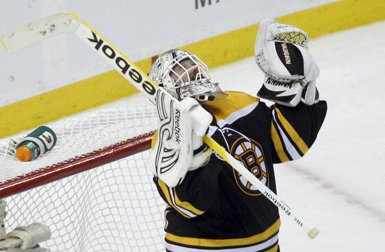 Boston Bruins goalie Tim Thomas celebrates his team's 8-1 win against the Vancouver Canucks in Game 3 of the Stanley Cup Finals in Boston, Monday. (AP)