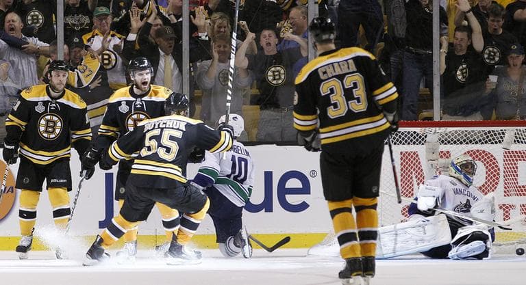 The Bruins celebrate after scoring a third period goal in Game 3 against the Canucks. (AP)