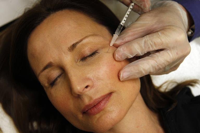 Botox is all the rage. Here, a woman receives a free injection of the anti-wrinkle drug after a job fair.  (AP)