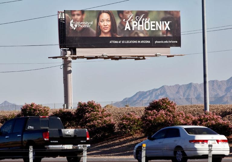 In this Nov. 24, 2009 photo, a University of Phoenix billboard is shown in Chandler, Ariz. The largest for-profit school in the country, Phoenix reported $4.5 billion in revenue last year. (AP)