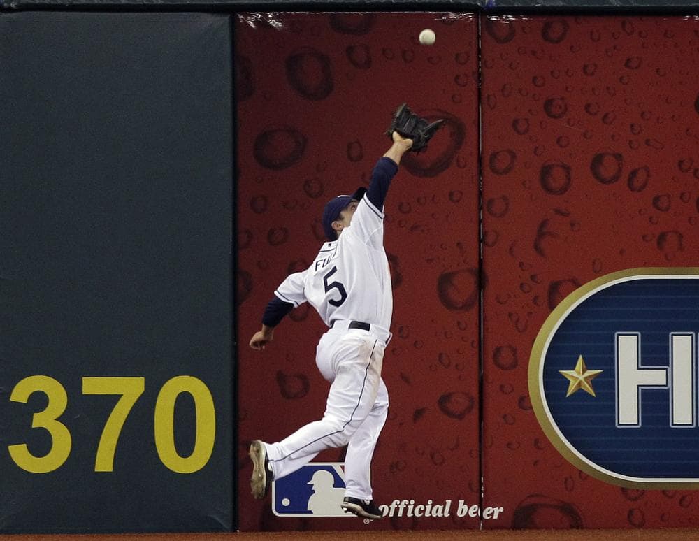 Tampa Bay Rays outfielder Sam Fuld makes another great catch in a game against the Cleveland Indians, May 27.  (AP)