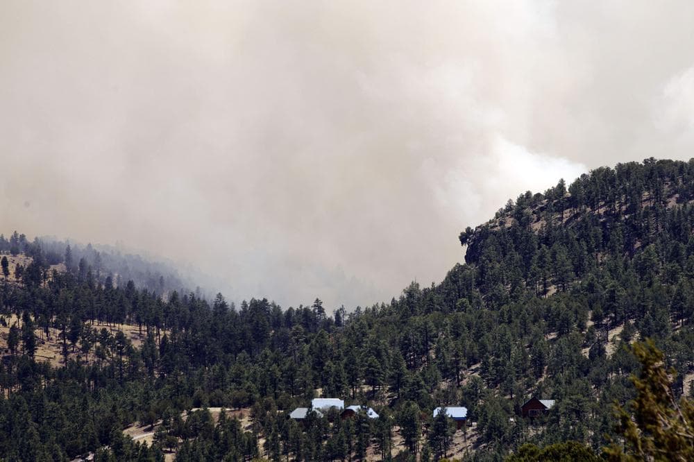 A group of cabins is threatened by the advancing Wallow Fire near Greer, Ariz. (AP)