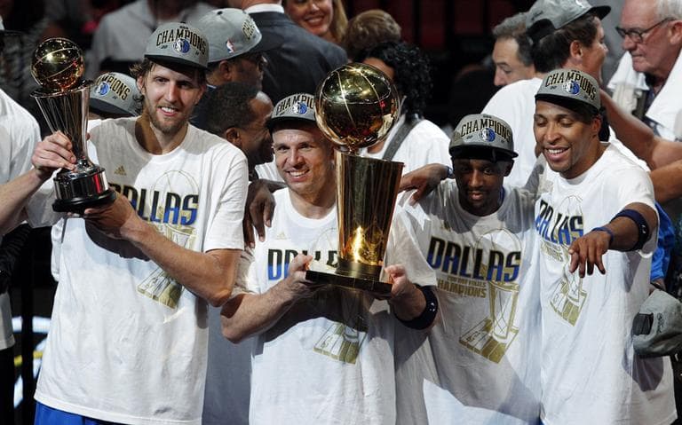 The Dallas Mavericks celebrate after Game 6 of the NBA Finals against the Miami Heat Sunday in Miami. The Mavericks won 105-95 to win the series. (AP)