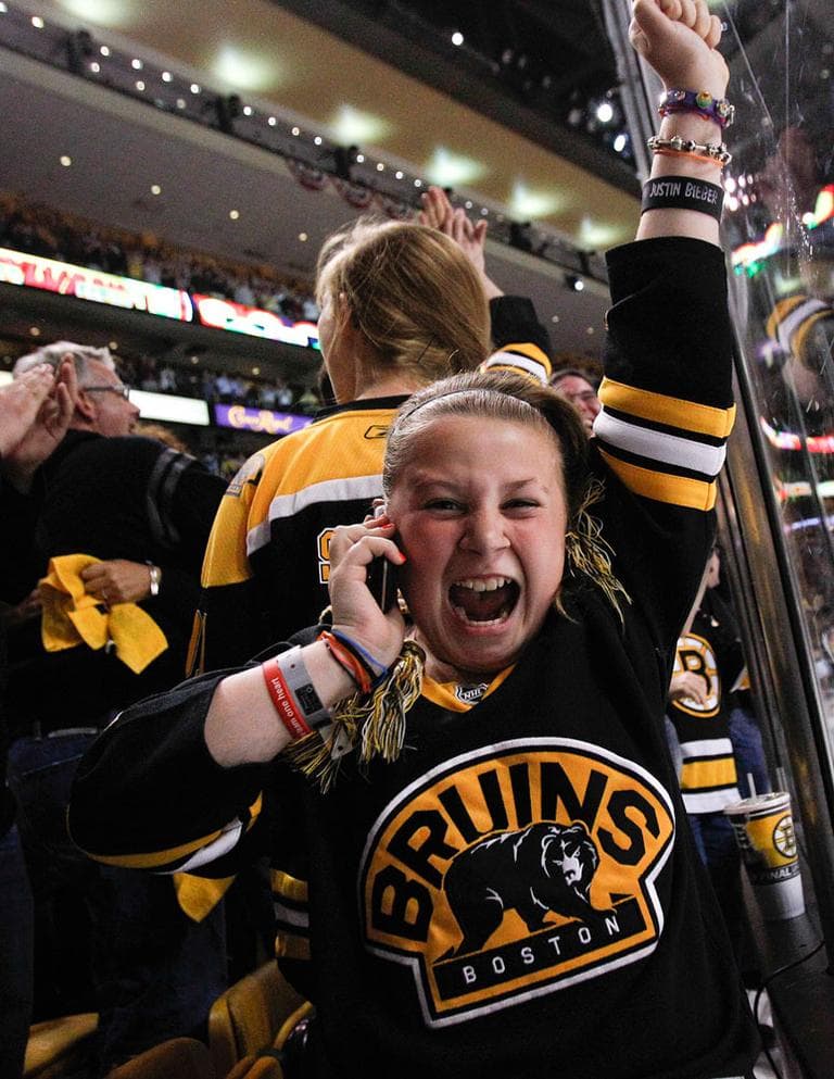 A Bruins fan reacts after Boston scored a fourth goal against the Canucks during Game 3 on June 6 in Boston. (AP)