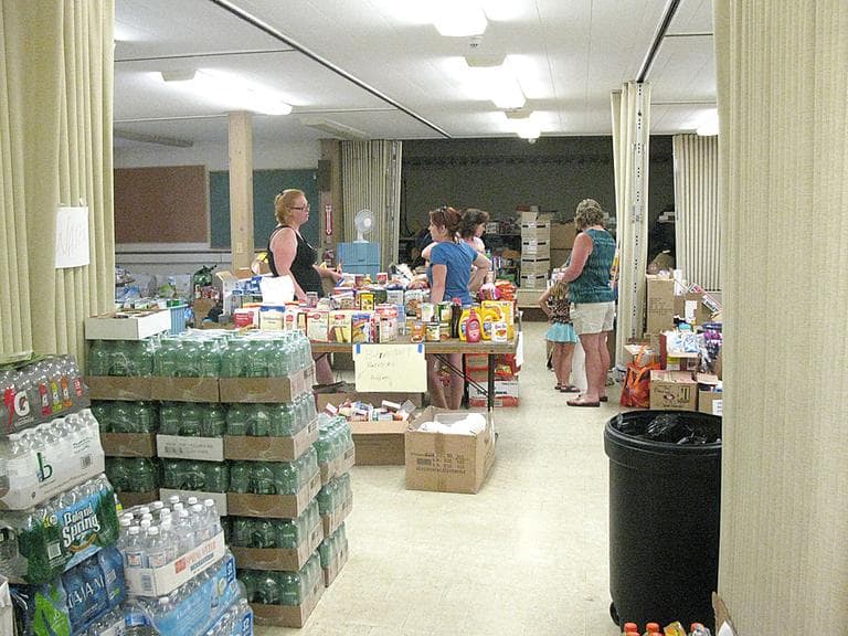 The basement of the First Congregational Church in Monson is laid out like a supermarket, so that tornado survivors can find what they need easily. (Fred Thys/WBUR)