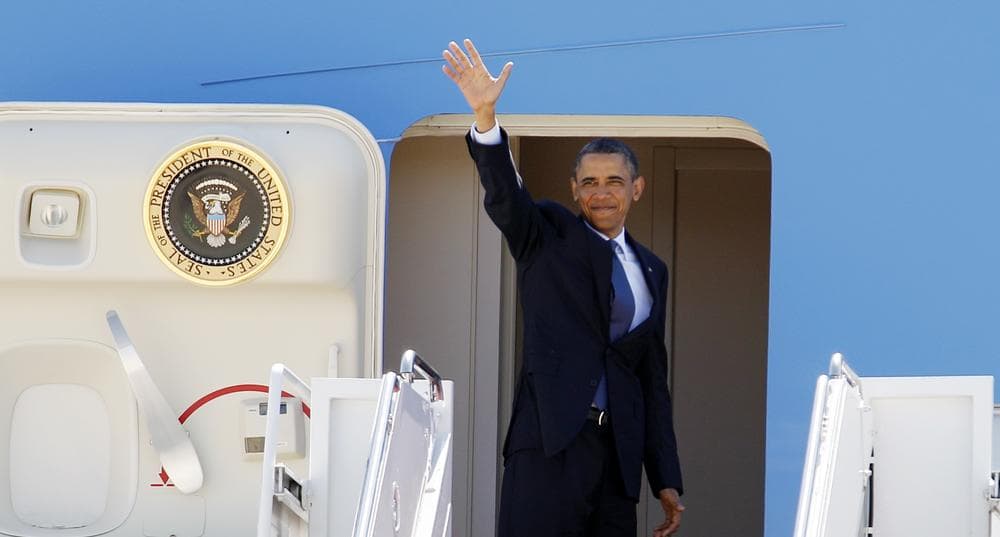 President Barack Obama waves from Air Force One before departing on a trip to promote job growth in Durham, N.C.(AP)