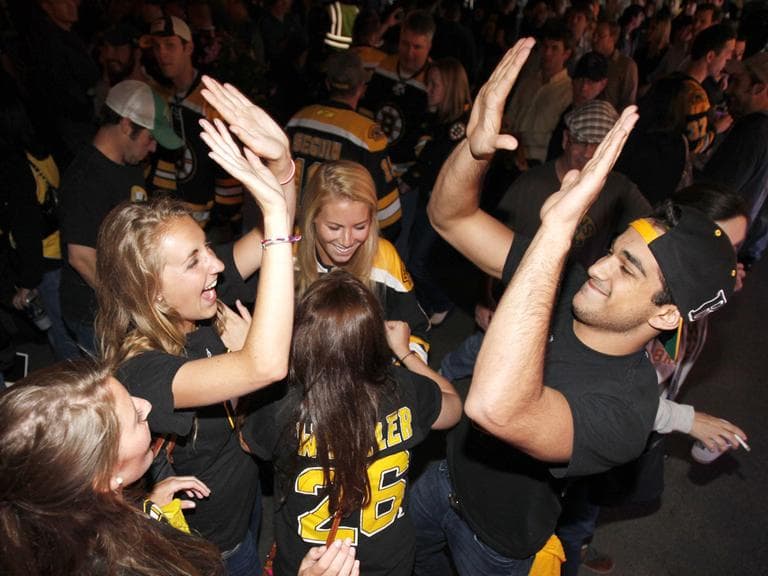 Boston fans celebrate after the Bruins beat the Vancouver Canucks 5-2 in Game 6 of the Stanley Cup Finals Monday. (AP)