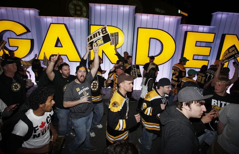 Boston Bruins fans celebrate in Boston after the Bruins beat the Vancouver Canucks 5-2 in Game 6 of the hockey Stanley Cup Finals, Monday. (AP)