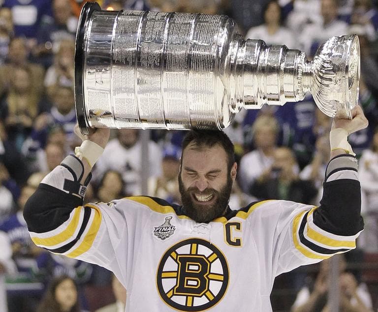 Bruins captain Zdeno Chara hoists the Stanley Cup after his team finished off the Canucks Wednesday. (AP)