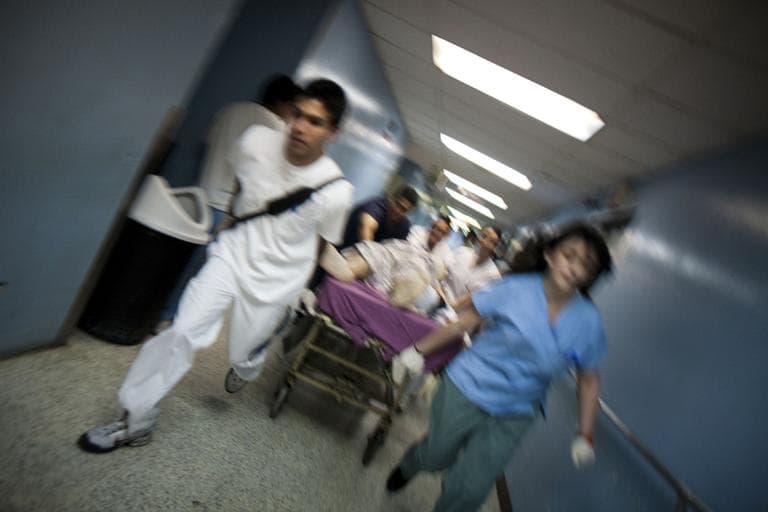 Medicine is a demanding field. Here medical students and paramedics rush a man with gunshot wounds to the operating room. (AP)
