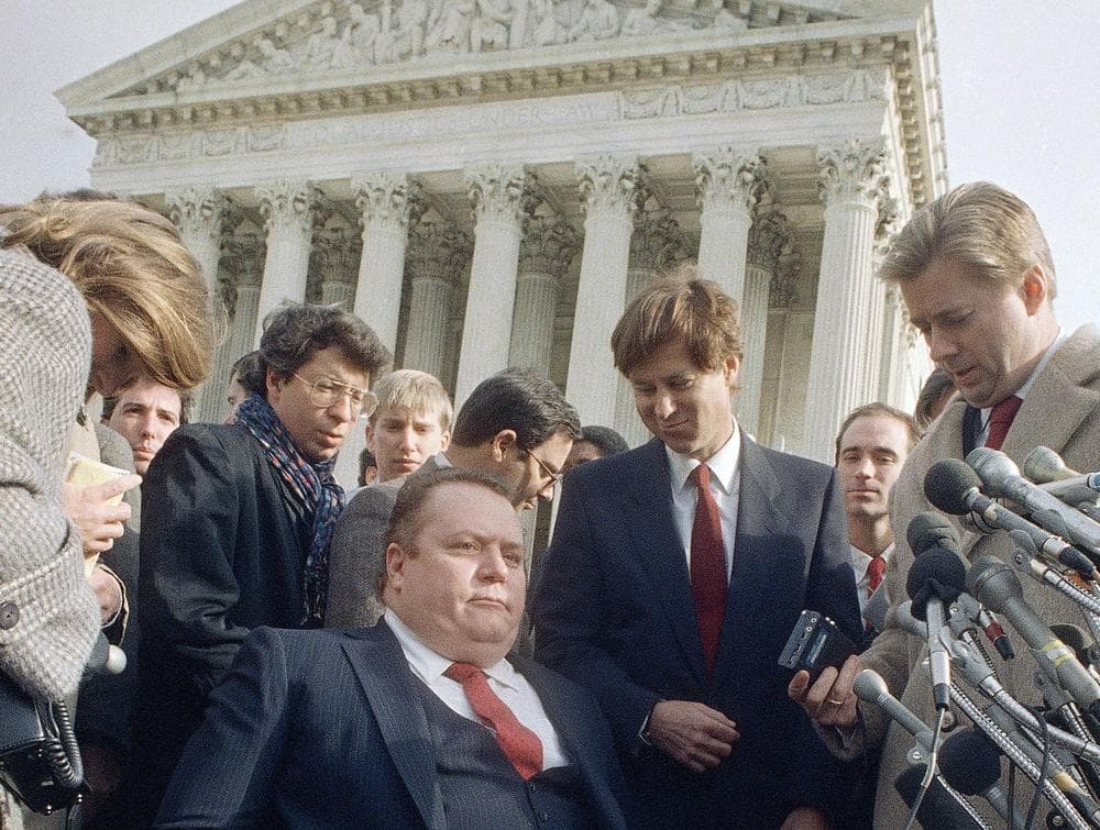 Sex magazine publisher Larry Flynt left the Supreme Court building in Washington, Dec. 3, 1987 after a court case for his magazine Hustler was heard. The magazine later won. (AP)