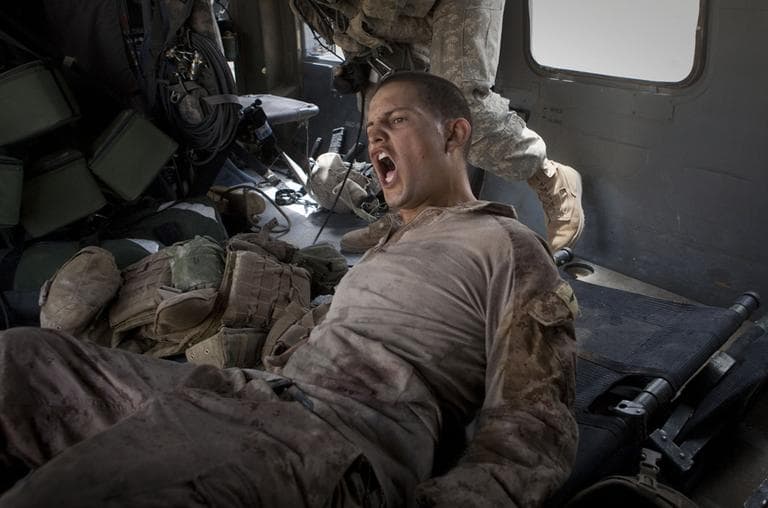 Lance Cpl. Blas Trevino from 1st Battalion, 5th Marines shouts as he is rescued on a medevac helicopter after he was shot in the stomach in Southern Afghanistan. (AP)