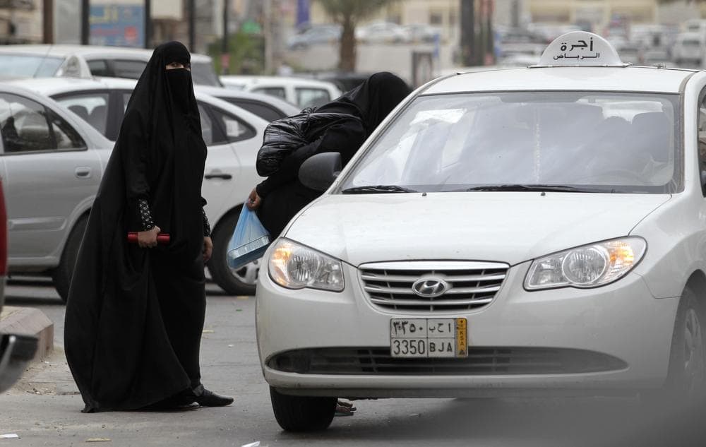 Saudi women board a taxi in Riyadh, Saudi Arabia. A campaign to defy Saudi Arabia's ban on women driving opened Friday, June 17, 2011 with female motorists getting behind the wheel, including one who took a 45-minute tour through the nation's capital, amid calls for sustained challenges to the restrictions in the ultraconservative kingdom. (AP)