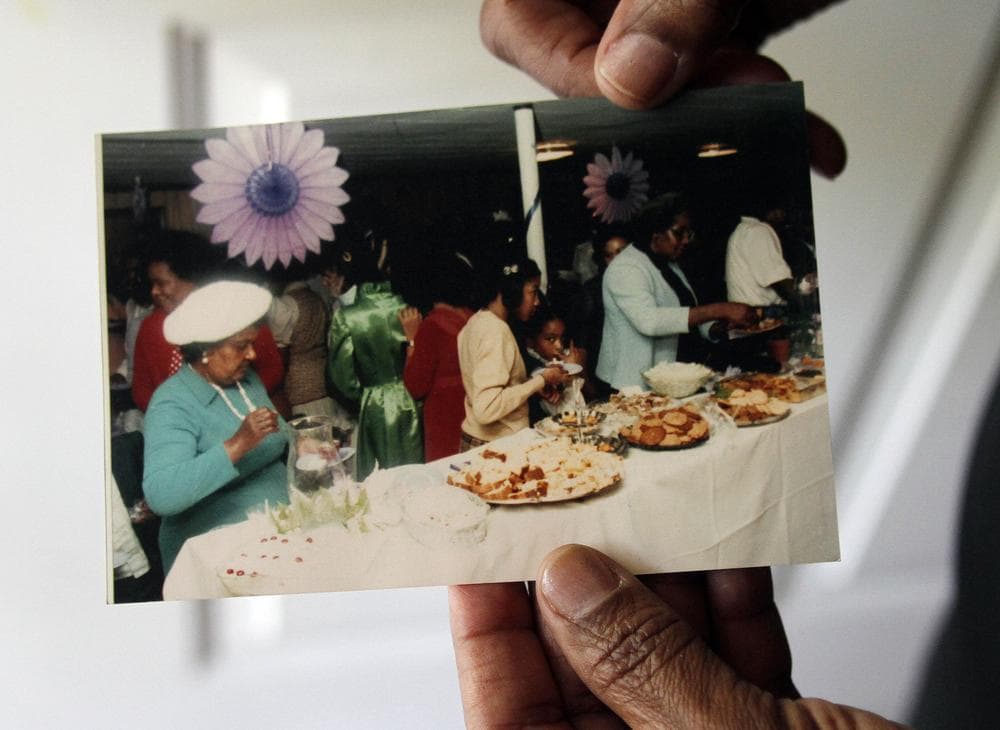Delores Marks holds a photograph of her mother, Margaret Helen Cheek, far left, at her home in Durham, N.C. Cheek was sterilized during North Carolina's eugenics program at Cherry Hospital in Goldsboro, N.C., where she was a patient for more than 10 years. (AP)