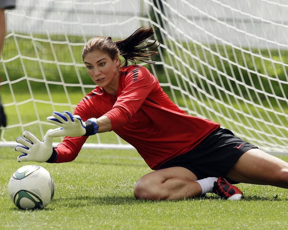 US goalkeeper Hope Solo stops a shot during a training session in Dresden, Germany, Friday. (AP)