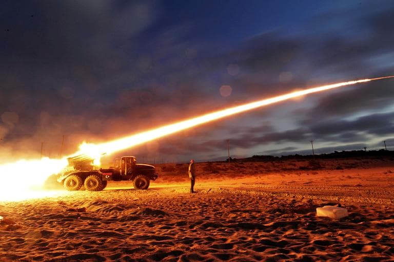 Rebel fighters fire a Grad rocket at the front line west of Misrata, Libya, on June 20, 2011. (AP)