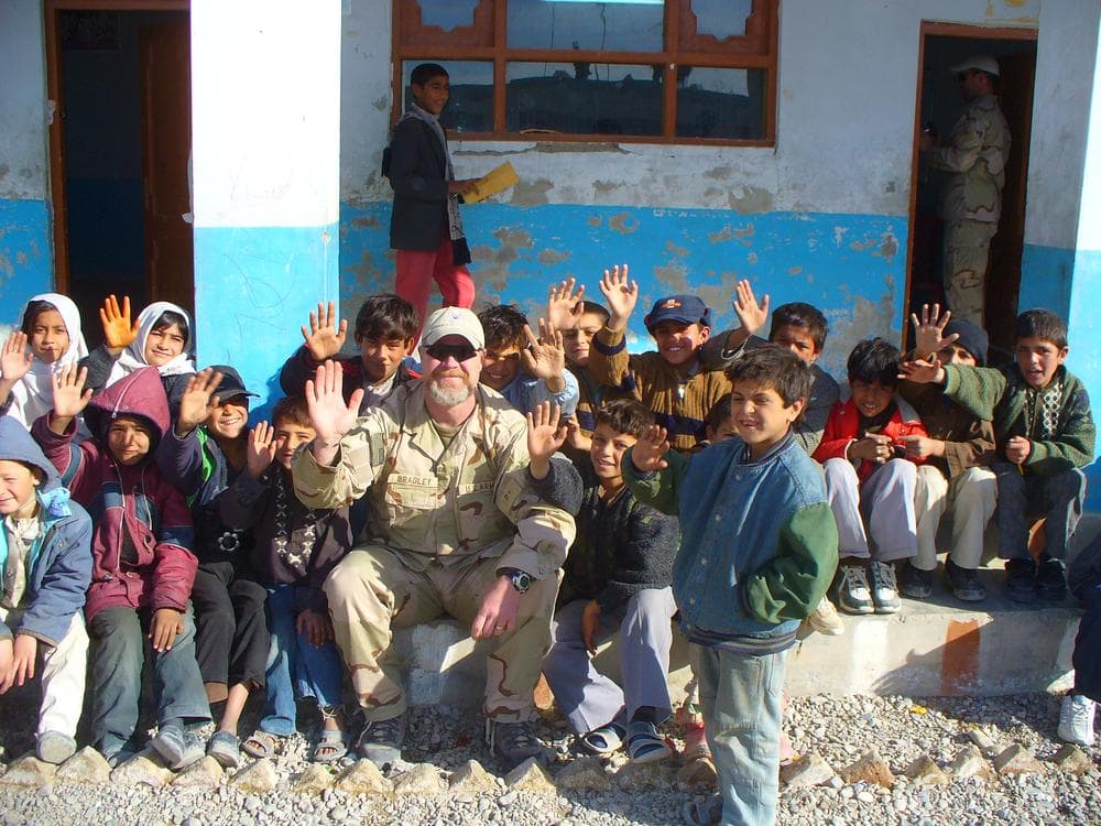 Rusty Bradley poses with Afghans in 2006. (Rusty Bradley)