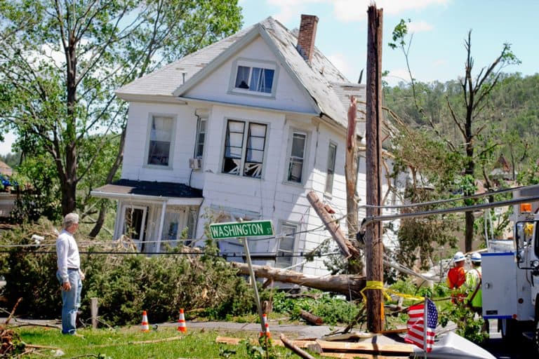 A house sits torn apart on Washington Street in Monson, Mass. (Jesse Costa/WBUR)