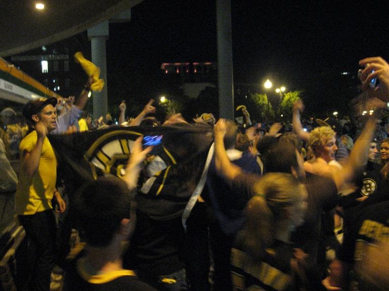 Bruins fans celebrate outside TD Garden in Boston after the Bruins won Game 7 in Vancouver. (Curt Nickisch/WBUR)