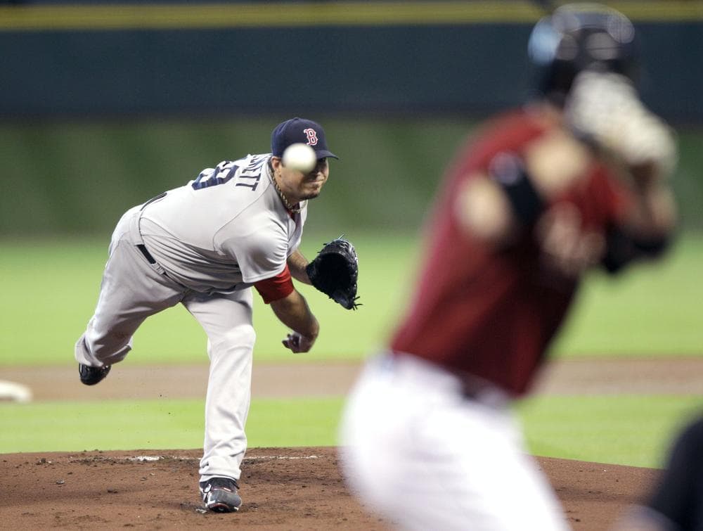 Boston Red Sox starting pitcher Josh Beckett, left, throws to Houston Astros&#039; Clint Barmes during the first inning of an interleague baseball game on Sunday in Houston. (AP)