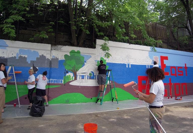 City Year corpsmembers paint a mural in East Boston.(cityyear/Flickr)