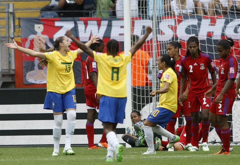 Brazil (yellow) defeated Equatorial Guinea in a Women's World Cup match Wednesday in Frankfurt. Only Brazil, Sweden and host Germany were undefeated in the group stage. (AP)