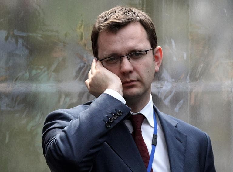 In this 2010 file photo, Andy Coulson, formerly editor of the tabloid News of the World, and later David Cameron&#039;s director of communications, speaks on a mobile phone in London. (AP)
