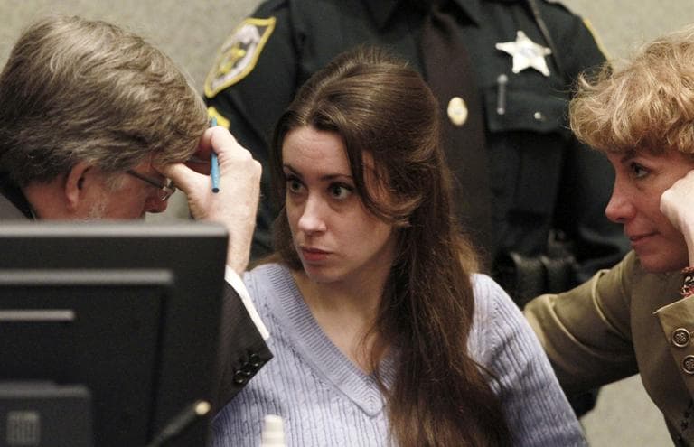 Casey Anthony talks with her attorneys before the start of her sentencing hearing at the Orange County Courthouse in Orlando, Fla. While acquitted of killing and abusing her daughter, Caylee, Anthony was convicted of four counts of lying to police officials trying to find her daughter. (AP)