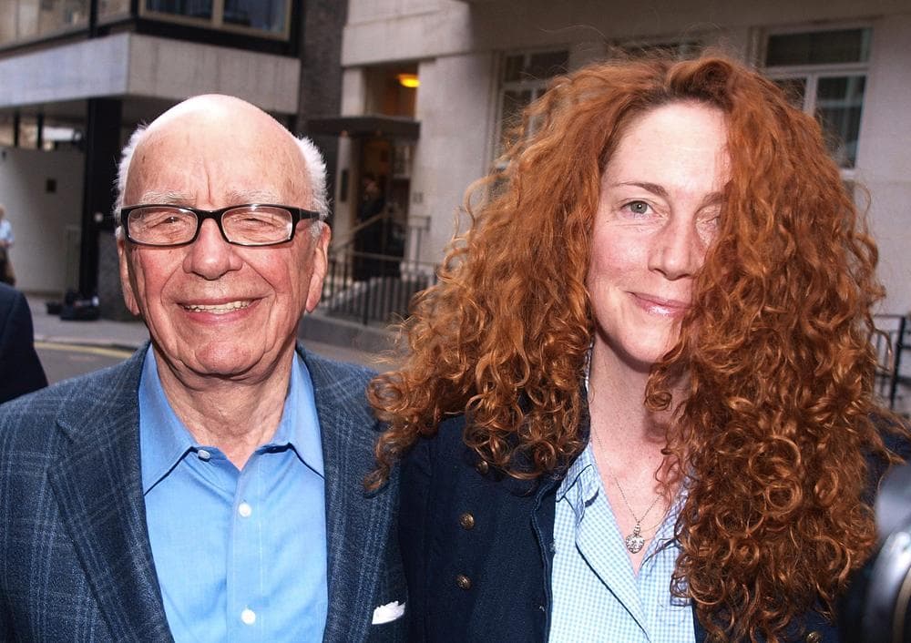 Chairman of News Corporation Rupert Murdoch, left, and Chief executive of News International Rebekah Brooks as they leave his residence in central London. (AP)