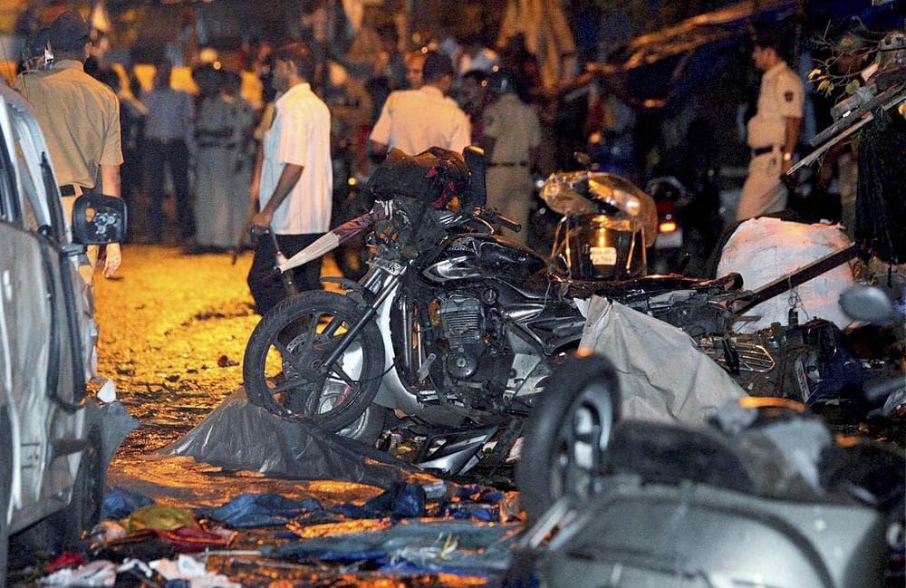 Wreckage of motorbikes lie at the site of a bomb explosion outside Opera House in Mumbai, India, Wednesday, July 13, 2011. (AP)