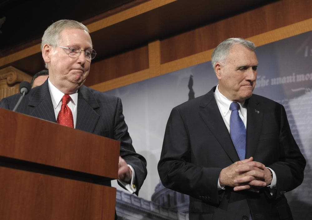 Senate Minority Leader Mitch McConnell of Ky., left, and Senate Minority Whip Jon Kyl of Ariz., leave after a news conference on Capitol Hill in Washington, Tuesday, July 12, 2011. (AP)