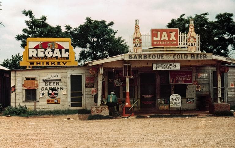A crossroads business serves as store, bar, juke joint, and gas station in the cotton plantation area, Melrose, La., June 1940. (AP)