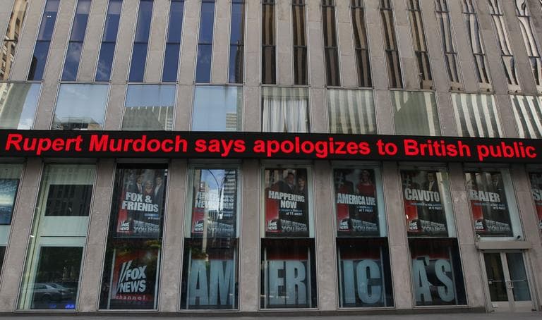News about Rupert Murdoch is displayed on the Fox News ticker at building which houses the News Corp. headquarters in New York. (AP)