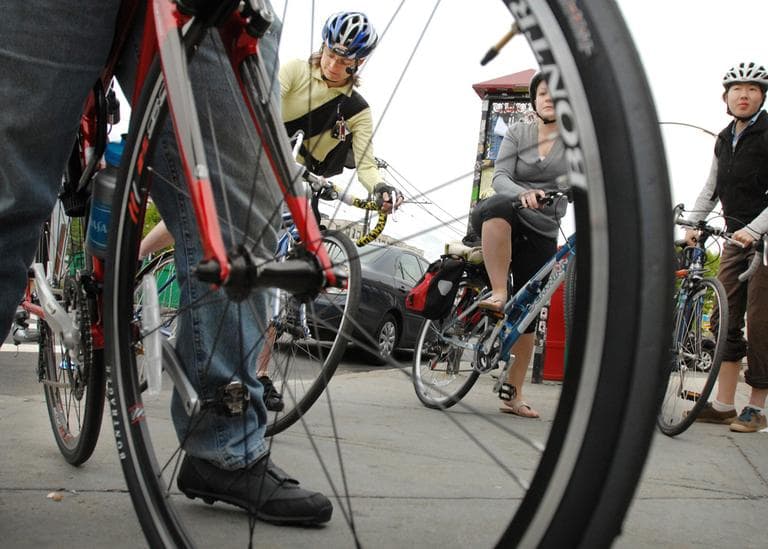 Boston's urban cyclists set off. Whose's roads are these? (AP)